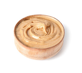 Bowl with tasty peanut butter on white background