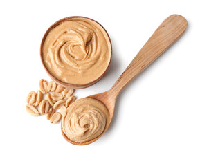 Bowl and spoon with tasty peanut butter on white background