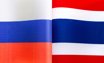 fragments of the national flags of Russia and Thailand close-up