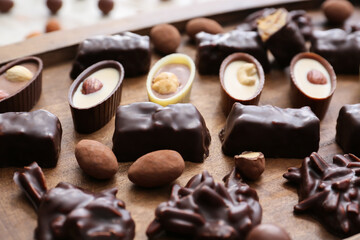 Tray with tasty chocolate candies, closeup