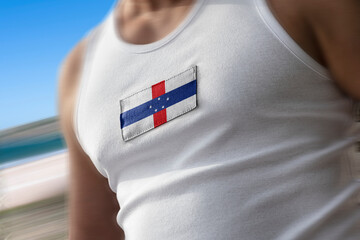The national flag of Netherlands Antilles on the athlete's chest