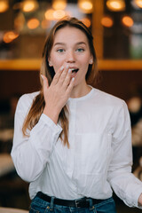 Headshot portrait of smiling young woman. Close up.