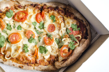 Fresh pinsa in a cardboard box food delivery concept. Pinsa pastries.