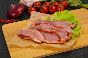 Sliced smoked duck breast served salad