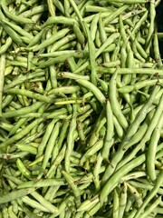 Close up of raw green beans for sale in a wet market