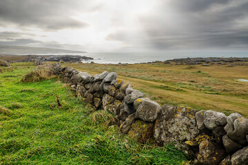 Old stone wall and excellent example of old masonry craft. West coast of Ireland. Atlantic ocean,...