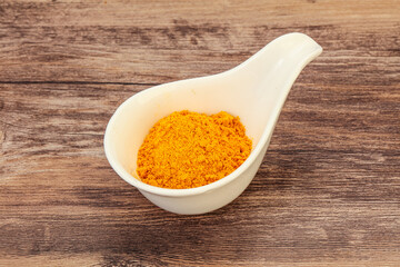 Tumeric powder in the bowl
