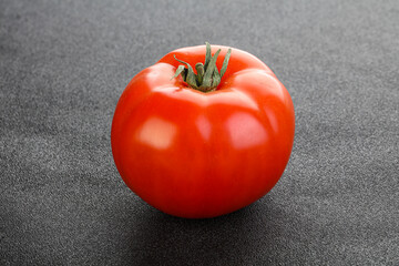 Red ripe big tomato isolated