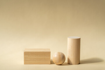 Empty wooden podiums of abstract geometric shapes for product presentations. Copy space for your design