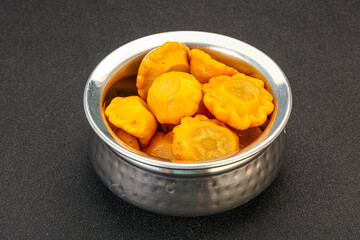 Marinated yellow patisson in the bowl