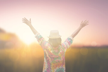 women hand up at sunrise nature background