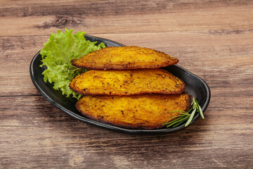 Baked potato with herbs and spices