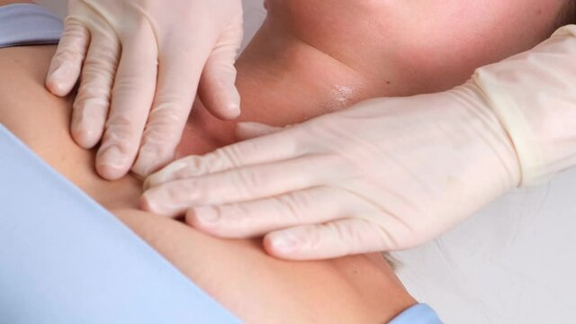 Skincare - woman cleavage massage at salon.