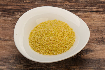 Raw cous cous heap in the bowl