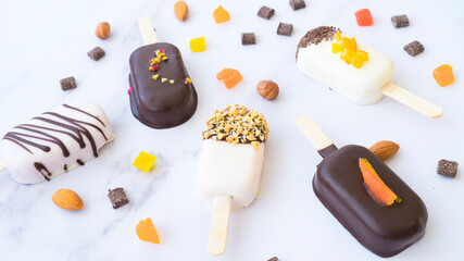 Assorted popsicle cakes on a light background. Image with selective focus