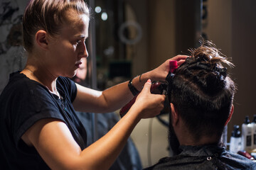 Beard correction in barbershop salon by master for guy, hair fashion