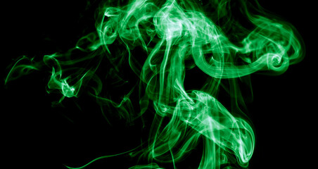 Green smoke isolated on black background. Abstraction