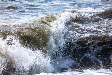 Splashing big waves on the seashore.