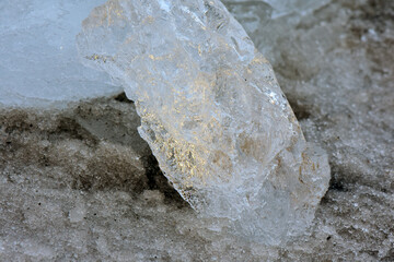 Ice stone on snow in cloudy day