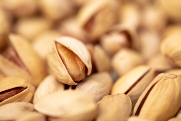 Close-up of fresh pistachio nuts as background.