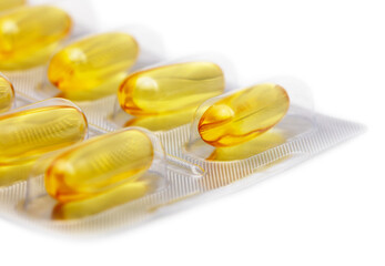 Yellow transparent pills of fish oil