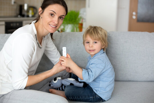 Mother, Testing Her Child For Covid At Home, Making Home Allowed Swab Tests