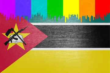 Paint (rainbow flag) is dripping over the national flag of Mozambique
