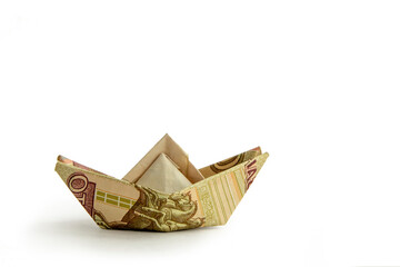 Ship from a money isolated on white background