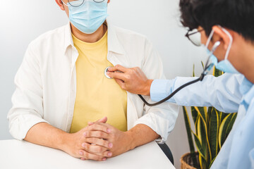 Doctor wear face mask comforting Measuring arterial blood pressurecare patient care, helping,...