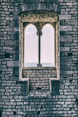 Old vintage window on an ancient facade. No people