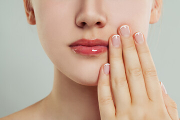 Sweet woman face close up and hands with manicured nails. Manicure concept