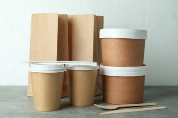 Delivery containers for takeaway food on gray textured table