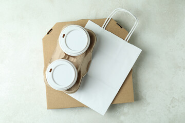 Delivery containers for takeaway food on white textured table