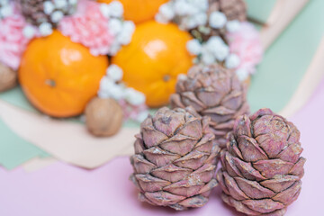 Juicy tangerines with greta nuts and decorated with flowers .Close-up .Concept of a useful gift; congratulations on the holiday.