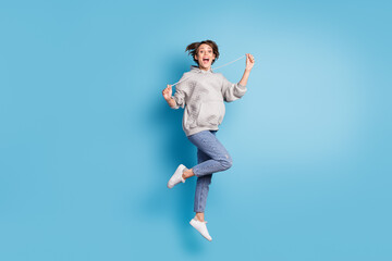 Fototapeta na wymiar Full length body size photo of funky girl jumping high careless playful isolated vivid blue color background