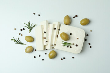 Feta cheese and spices on white background