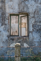 Old vintage window on an ancient facade. No people