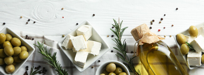 Concept of tasty food with feta cheese on white wooden background