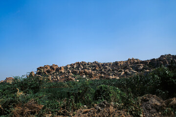 Mountains with grass and trees and the sky