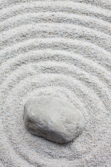 Fototapeta na wymiar Stone on white sand