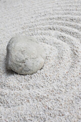 Fototapeta na wymiar Stone on white sand