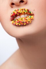 Lips covered with multicolor surface for cakes