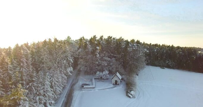 Small chapel in a winter landscape. Taken with a drone that wonderfully shows the winter landscape.