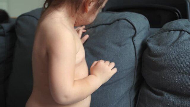 Toddler girl with chickenpox measles on the body. Varicella virus childhood contagious disease. Itchy red blisters, fever, pain symptoms. 