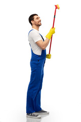 profession, service and people - happy smiling male worker or cleaner in overal and gloves with window cleaning mop over white background