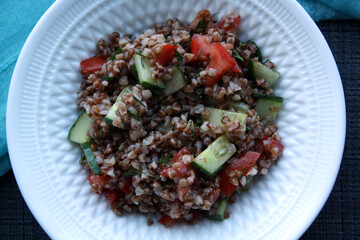 Salad of buckwheat, tomatoes, cucumbers and dill.
