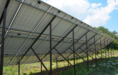A rear view, bottom view of the solar panels mounted on the ground. Solar energy panels...