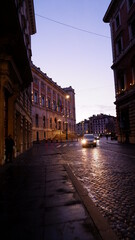 Fototapeta premium Evening or night view of old cozy street in Rome, Italy. Cityscape of italian capital with nobody.