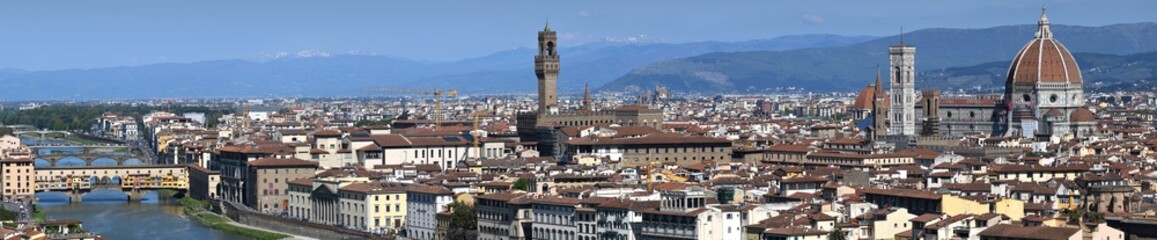 Fototapeta na wymiar Panorama view of cityscape of the city of Florence with Old Bridge (Ponte Vecchio) Palace of Town Hall and Cathedral of Santa Maria del Fiore. Italy.