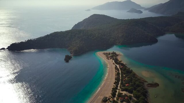 Amazing high angle top drone view on world famous paragliding and parasailing turkish spot for extrim parachute sport in Oludeniz in Fethiye, Turkey
